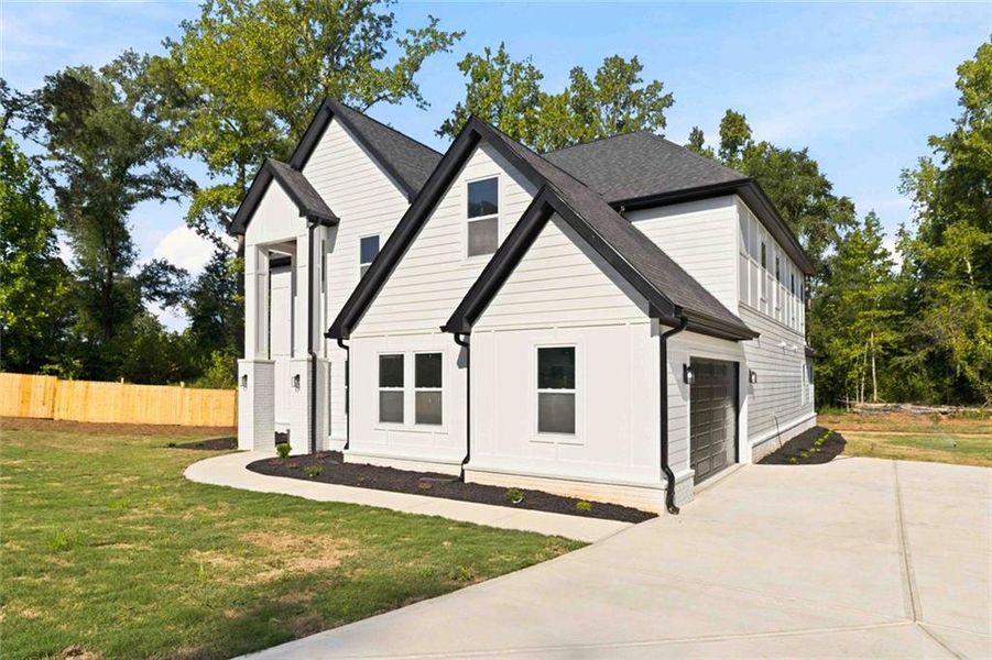 Front exterior of a new home in , Griffin, GA, highlighting curb appeal (Image 27).