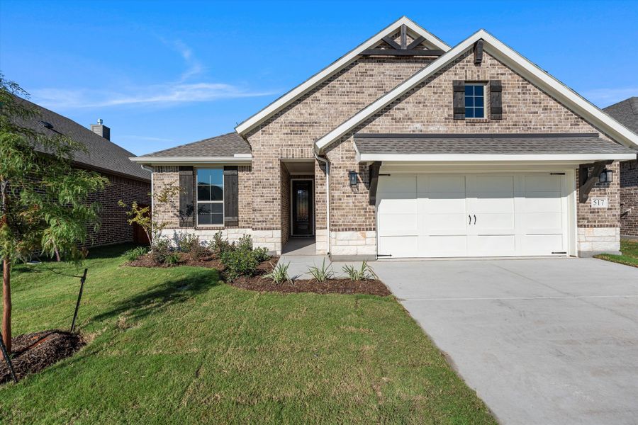 Front exterior of a new home in Morningstar, Aledo, TX, highlighting curb appeal (Image 24).