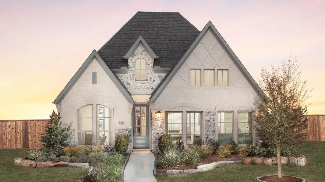 Front exterior of a new home in Devonshire, Forney, TX, highlighting curb appeal (Image 2). Front exterior of a new home in Devonshire, Forney, TX, highlighting curb appeal (Image 2).