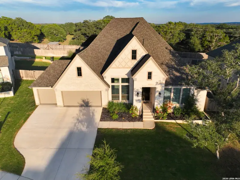 Front exterior of a new home in The Ranches at Creekside, Boerne, TX, highlighting curb appeal (Image 26). Front exterior of a new home in The Ranches at Creekside, Boerne, TX, highlighting curb appeal (Image 26).