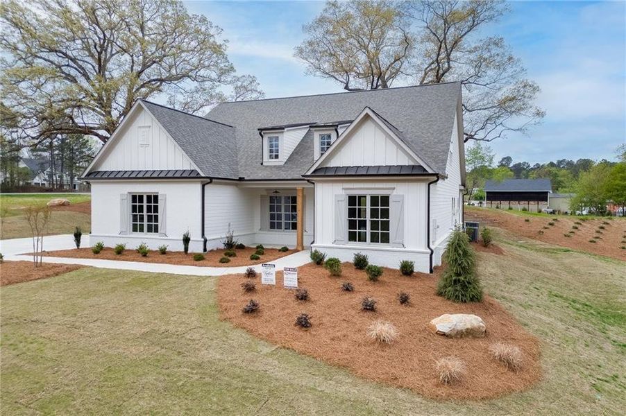 Front exterior of a new home in , Cumming, GA, highlighting curb appeal (Image 26).