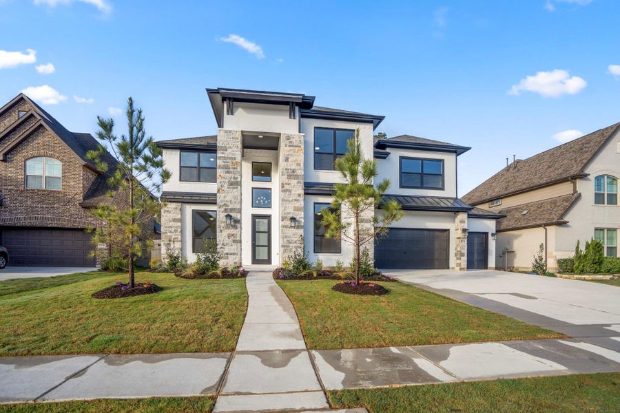 Front exterior of a new home in ARTAVIA 70′ Lots, Conroe, TX, highlighting curb appeal (Image 24).