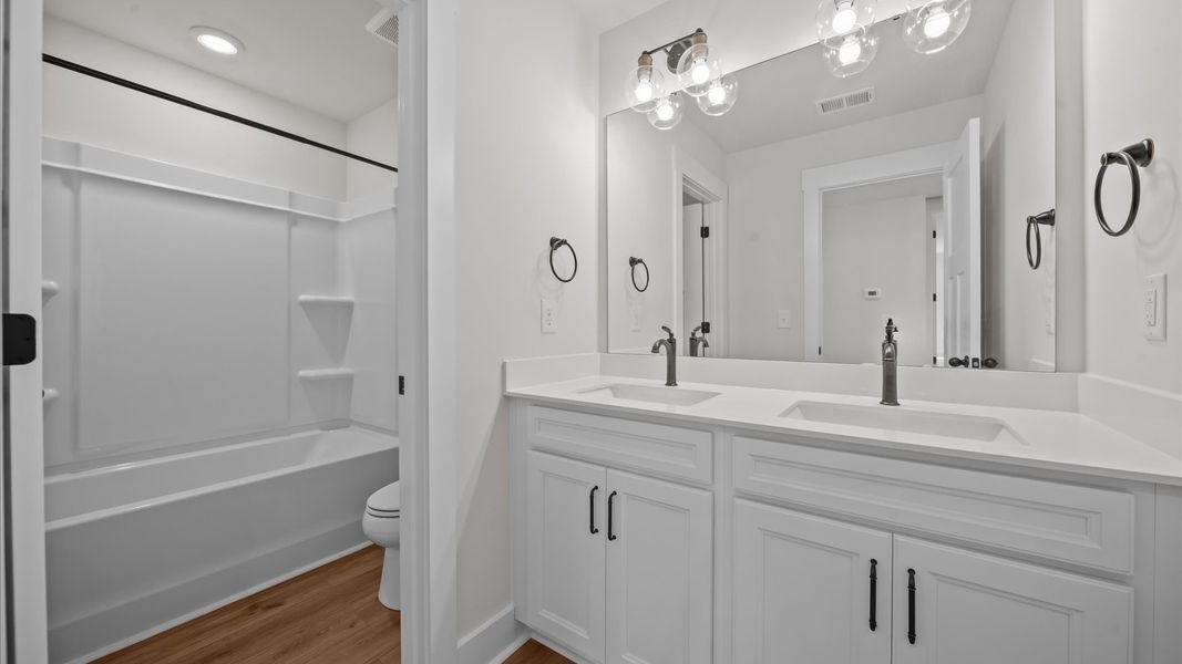 Elegant bath retreat with designer finishes and a clean, timeless aesthetic Elegant bath retreat with designer finishes and a clean, timeless aesthetic