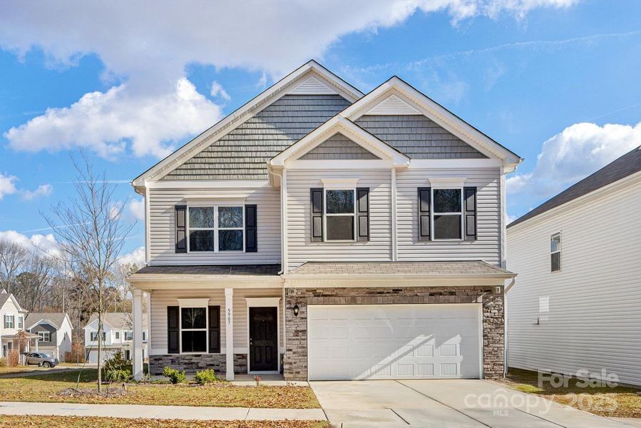 Front exterior of a new home in Wilora Pond, Charlotte, NC, highlighting curb appeal (Image 1). Front exterior of a new home in Wilora Pond, Charlotte, NC, highlighting curb appeal (Image 1).