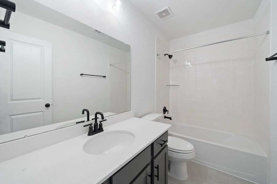 Secondary bath. Note: Sample product photo - actual exterior and interior selections may vary by homesite Secondary bath. Note: Sample product photo - actual exterior and interior selections may vary by homesite