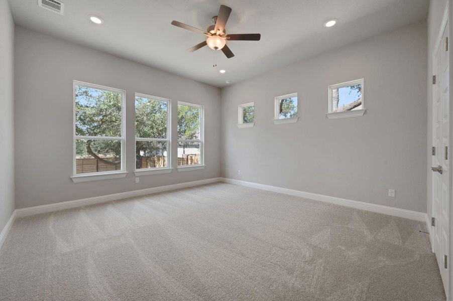 Spare room with carpet, recessed lighting, and ceiling fan