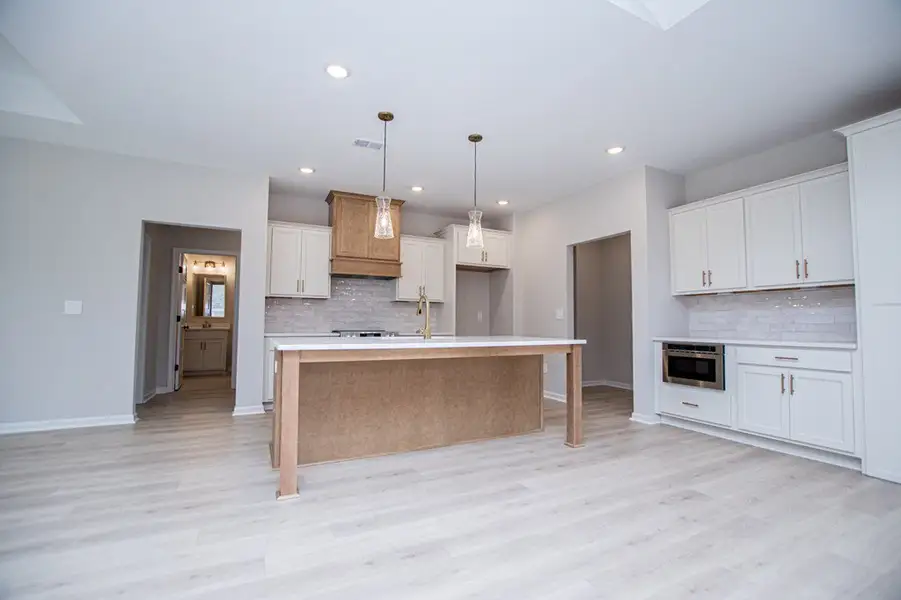 Furnished interior view inside a new home in WOODMONT RESERVE, Roopville (Image 6).