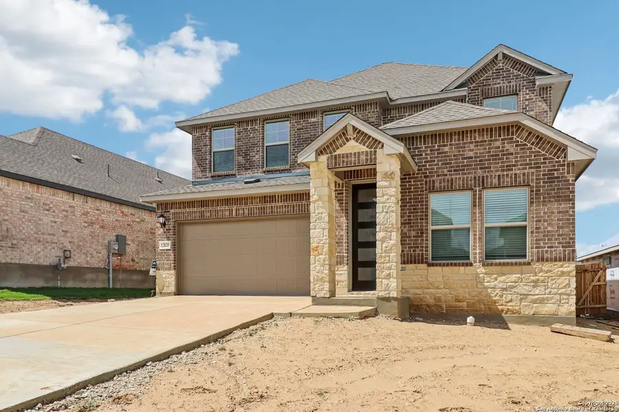 Front exterior of a new home in Arcadia Ridge - Premier Series, San Antonio, TX, highlighting curb appeal (Image 1).