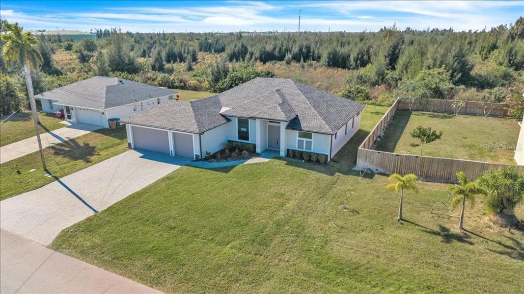 Front exterior of a new home in , Cape Coral, FL, highlighting curb appeal (Image 25).