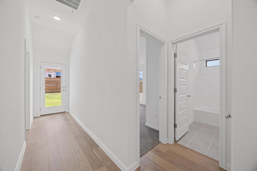 Hallway in the Cypress home plan by Trophy Signature Homes – REPRESENTATIVE PHOTO