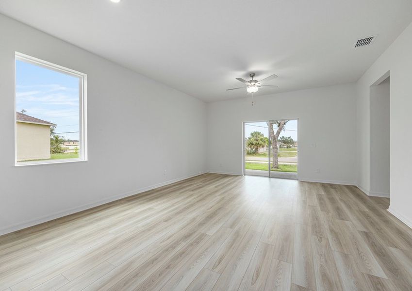 Family room with a sliding door that leads to the backyard