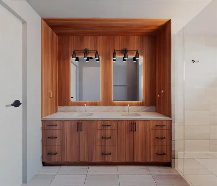 Bathroom with double vanity, a shower stall, and light tile patterned flooring