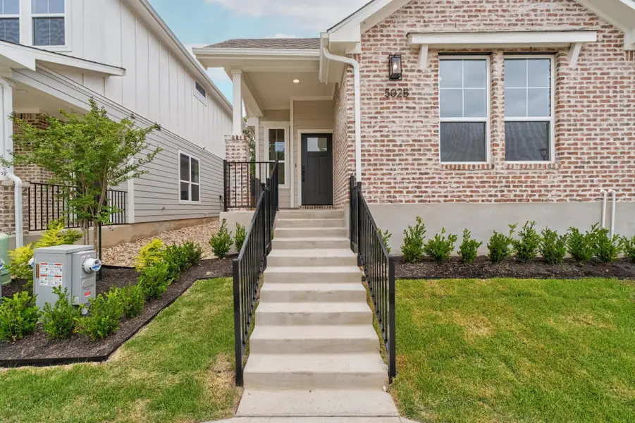 Front exterior of a new home in , Buda, TX, highlighting curb appeal (Image 2).