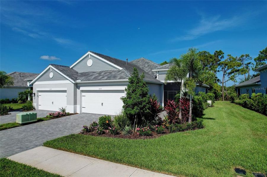 Front exterior of a new home in , Sarasota, FL, highlighting curb appeal (Image 26). Front exterior of a new home in , Sarasota, FL, highlighting curb appeal (Image 26).