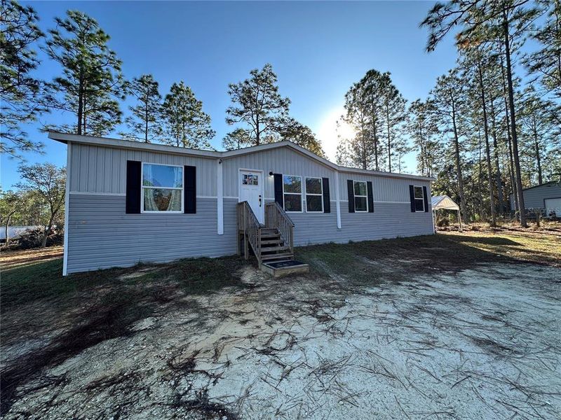 Exterior details and patio area of a home in , Williston (Image 23). Exterior details and patio area of a home in , Williston (Image 23).
