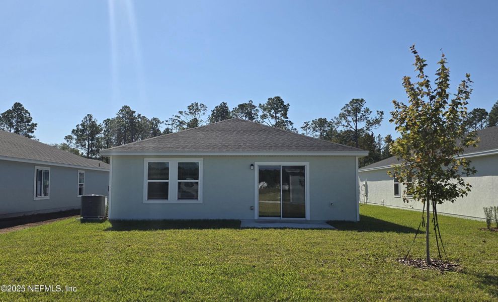 Exterior details and patio area of a home in Flagler Village - Classic Series, Palm Coast (Image 4).