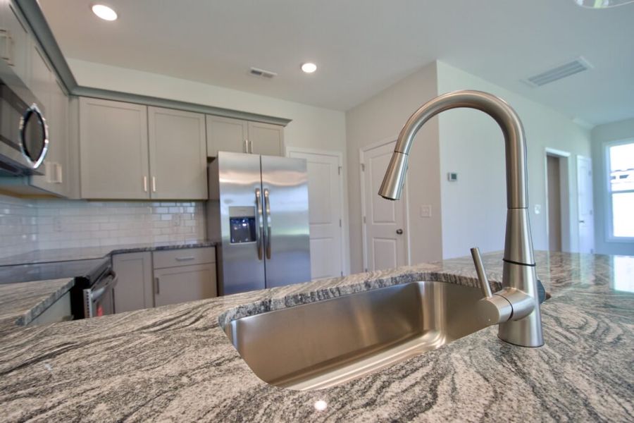 Representative furnished interior of a home built from the Naples by Stevens Fine Homes in River Tide Farms, Bolivia (Image 16).