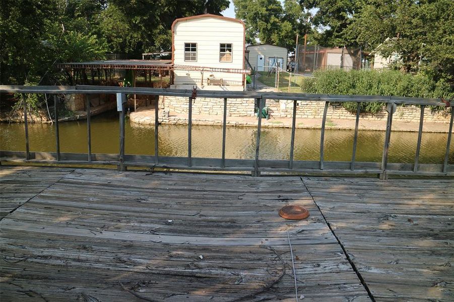 Deck featuring a water view Deck featuring a water view