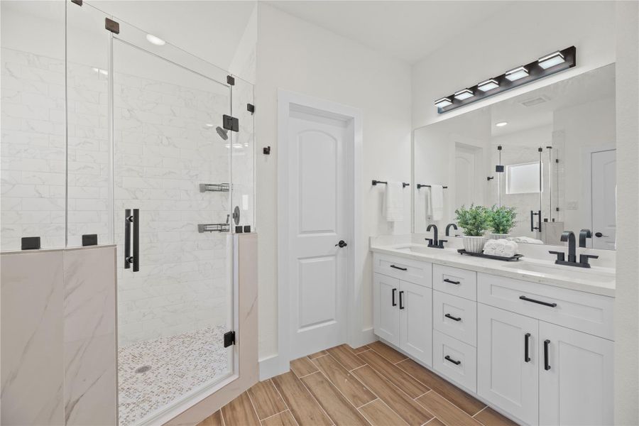 Every primary bedroom needs an en suite with class and sophistication! Delivering ample quantities of both, this spa-like sanctuary is well-equipped for the most glamourous of self-care routines. Every primary bedroom needs an en suite with class and sophistication! Delivering ample quantities of both, this spa-like sanctuary is well-equipped for the most glamourous of self-care routines.