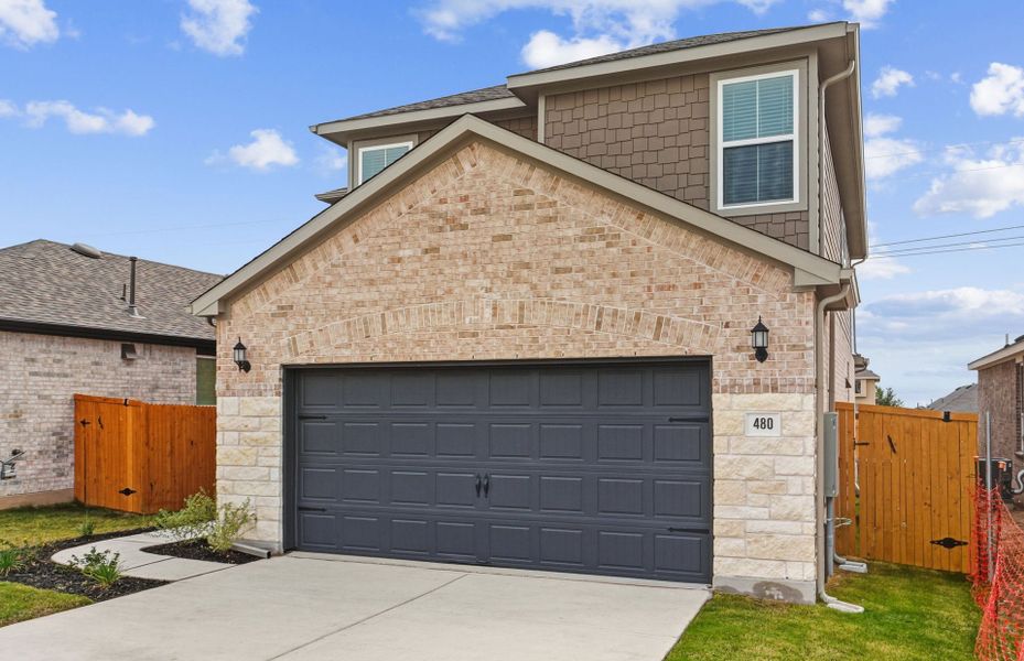 Front exterior of a new home in Crosswinds, Kyle, TX, highlighting curb appeal (Image 19).