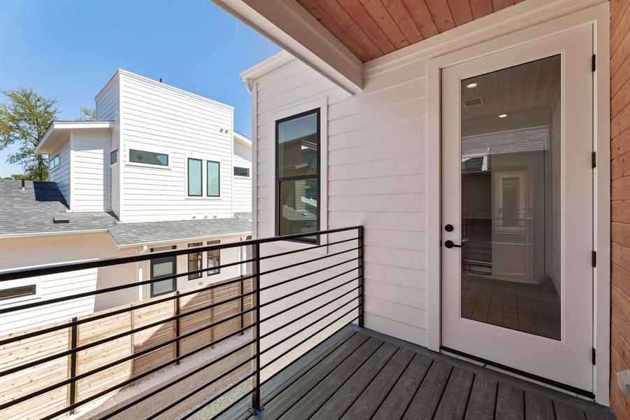 Primary bedroom with private balcony.