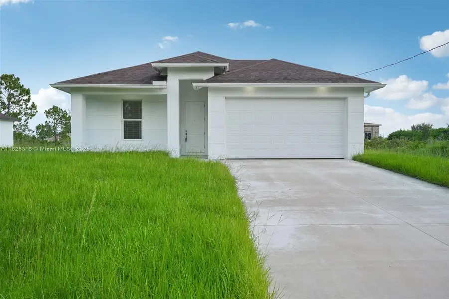 Front exterior of a new home in , Lehigh Acres, FL, highlighting curb appeal (Image 1). Front exterior of a new home in , Lehigh Acres, FL, highlighting curb appeal (Image 1).