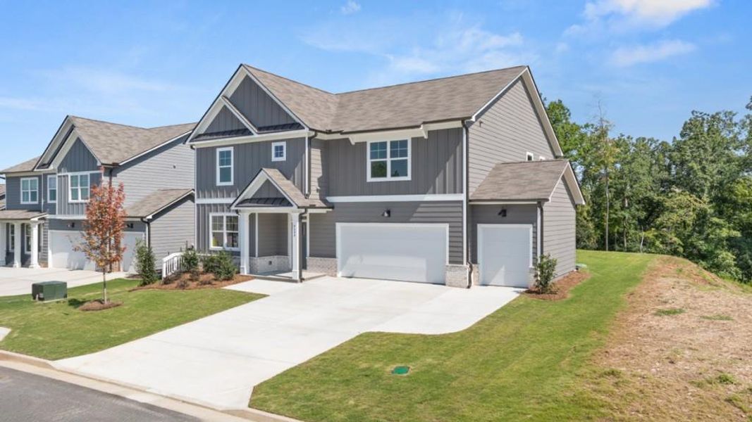 Front exterior of a new home in Falcon Landing, Gainesville, GA, highlighting curb appeal (Image 2). Front exterior of a new home in Falcon Landing, Gainesville, GA, highlighting curb appeal (Image 2).