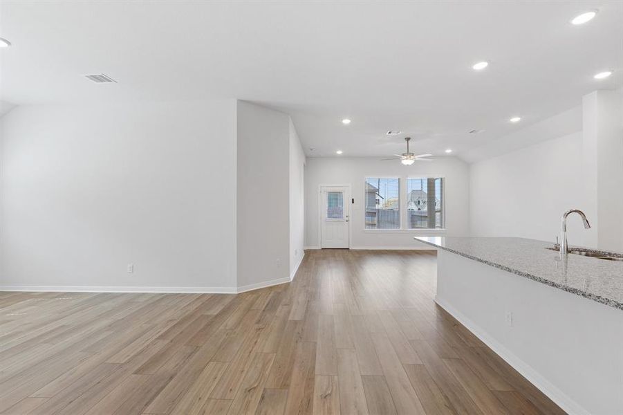 Down the entry hallway, Kitchen to the right, Dining room to the left and Living Room straight ahead with door to back patio.