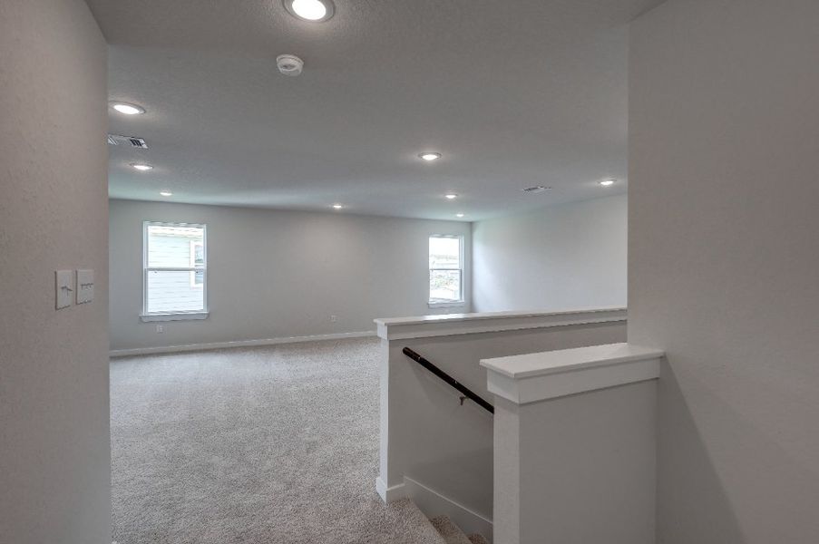 A room with a counter and a window. A room with a counter and a window.