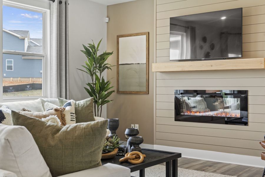 A living room with a fireplace. A living room with a fireplace.