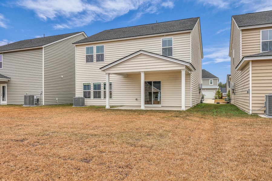 Exterior details and patio area of a home in Sweetgrass at Summers Corner: Carolina Collection, Summerville (Image 31).