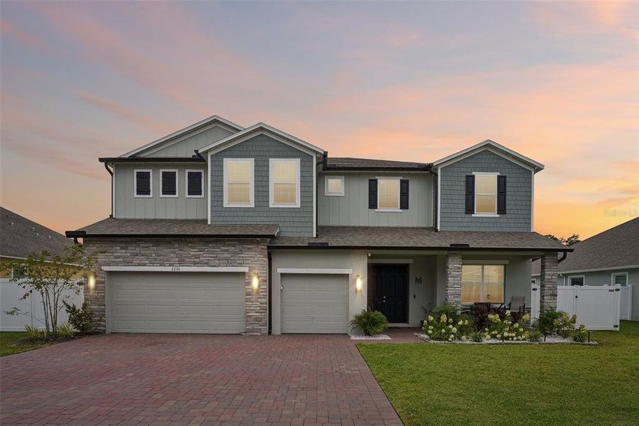 Front exterior of a new home in Elegant Manor Estates, Edgewater, FL, highlighting curb appeal (Image 24). Front exterior of a new home in Elegant Manor Estates, Edgewater, FL, highlighting curb appeal (Image 24).