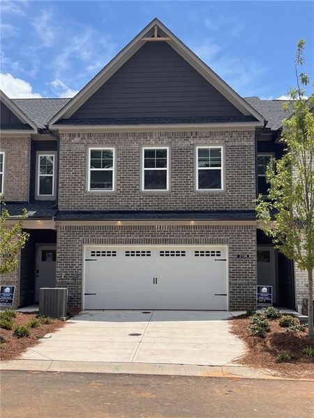 Front exterior of a new home in Governors Parc, Kennesaw, GA, highlighting curb appeal (Image 25).