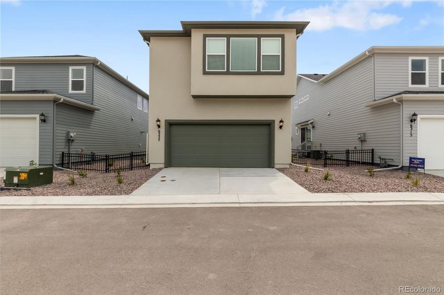 Front exterior of a new home in , Colorado Springs, CO, highlighting curb appeal (Image 25).