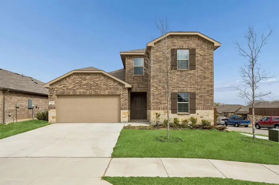 Front exterior of a new home in River's Edge, Fort Worth, TX, highlighting curb appeal (Image 21).
