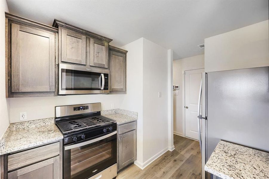 Furnished interior view inside a new home in Patriot Estates, Venus (Image 9).