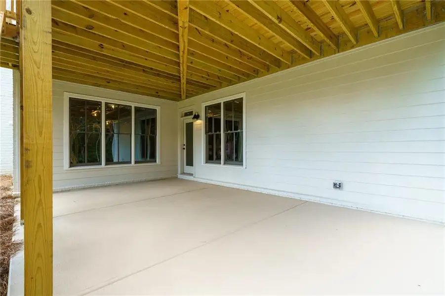 Exterior details and patio area of a home in Malone's Pond, Ball Ground (Image 25).
