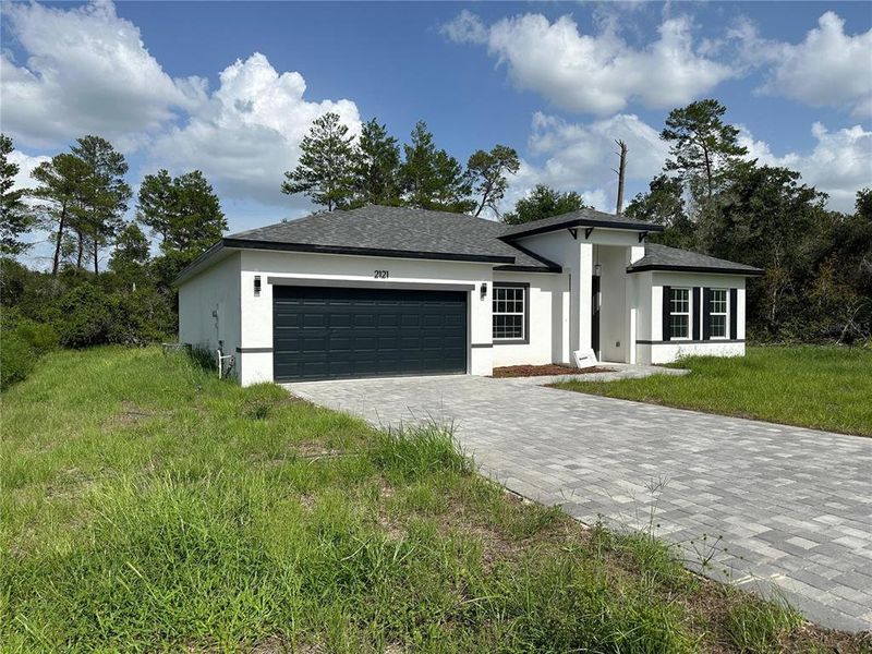 Front exterior of a new home in , Ocala, FL, highlighting curb appeal (Image 2).