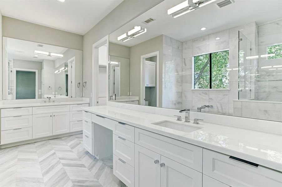 Elegant designer selected marble flooring and countertops.