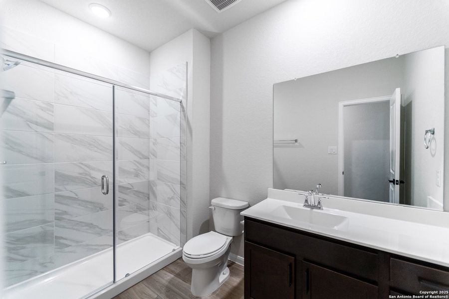 Furnished interior view inside a new home in The Woodlands at Medina Hills, Mico (Image 13).