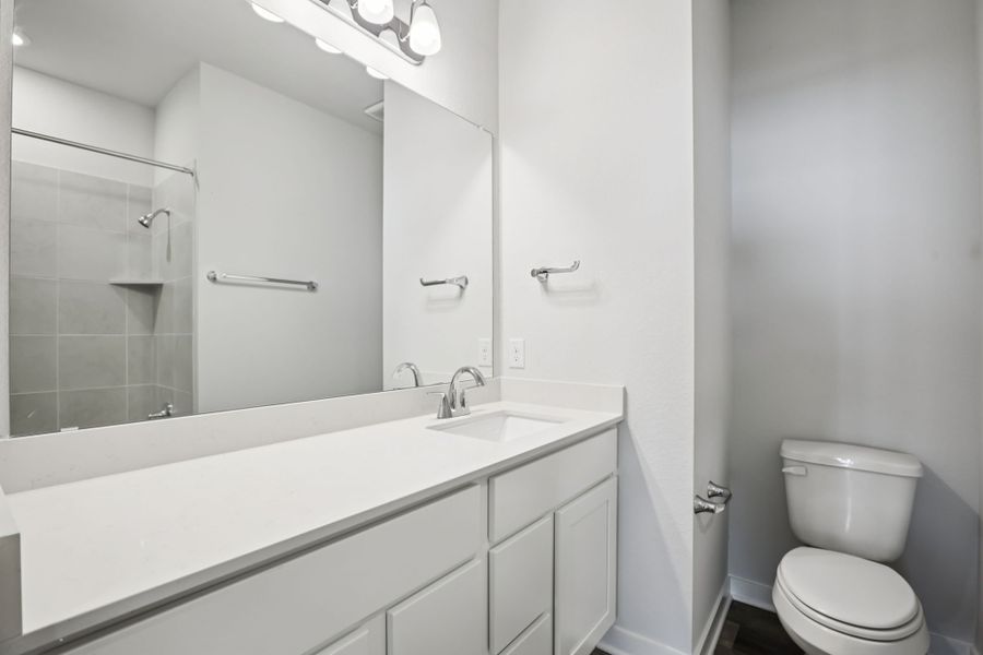 A bathroom with a glass shower.