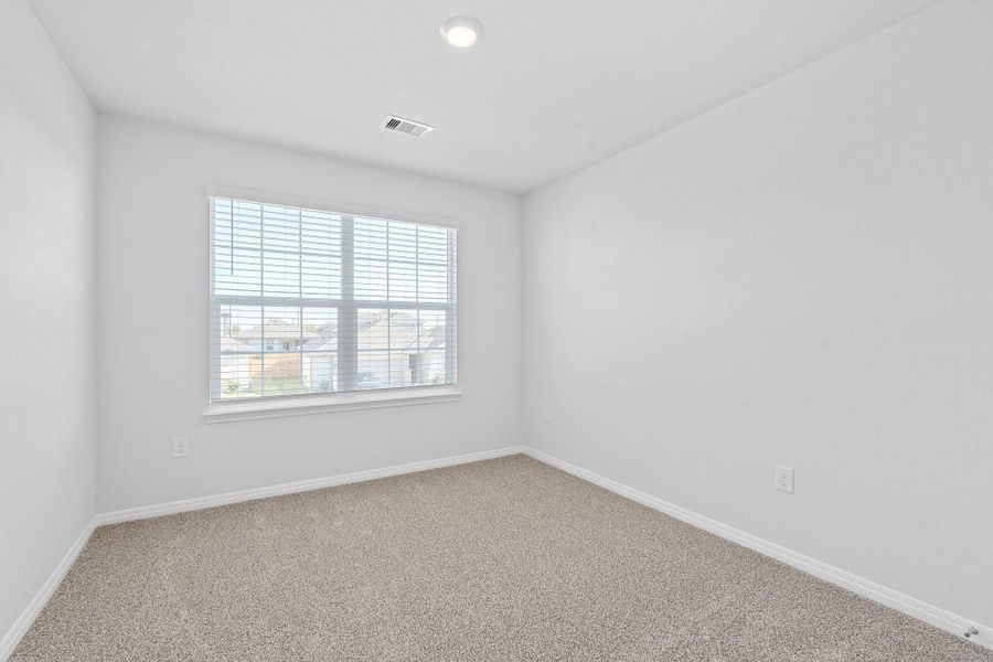 Carpeted spare room with baseboards Carpeted spare room with baseboards