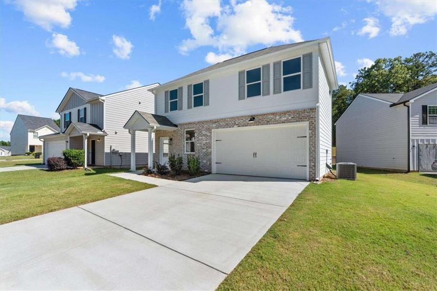 Front exterior of a new home in , Villa Rica, GA, highlighting curb appeal (Image 2). Front exterior of a new home in , Villa Rica, GA, highlighting curb appeal (Image 2).