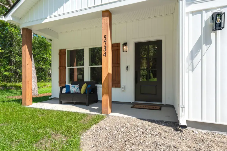 Exterior details and patio area of a home in , Ravenel (Image 23). Exterior details and patio area of a home in , Ravenel (Image 23).