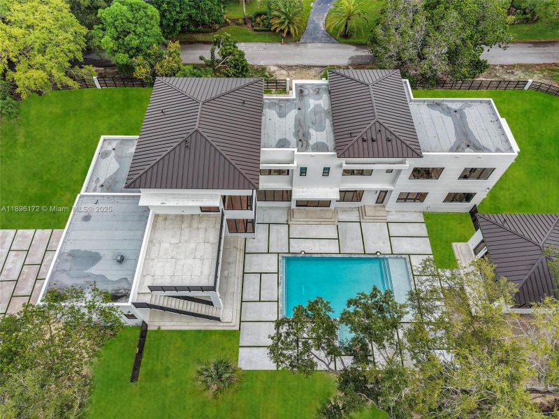 Front exterior of a new home in , Palmetto Bay, FL, highlighting curb appeal (Image 26). Front exterior of a new home in , Palmetto Bay, FL, highlighting curb appeal (Image 26).