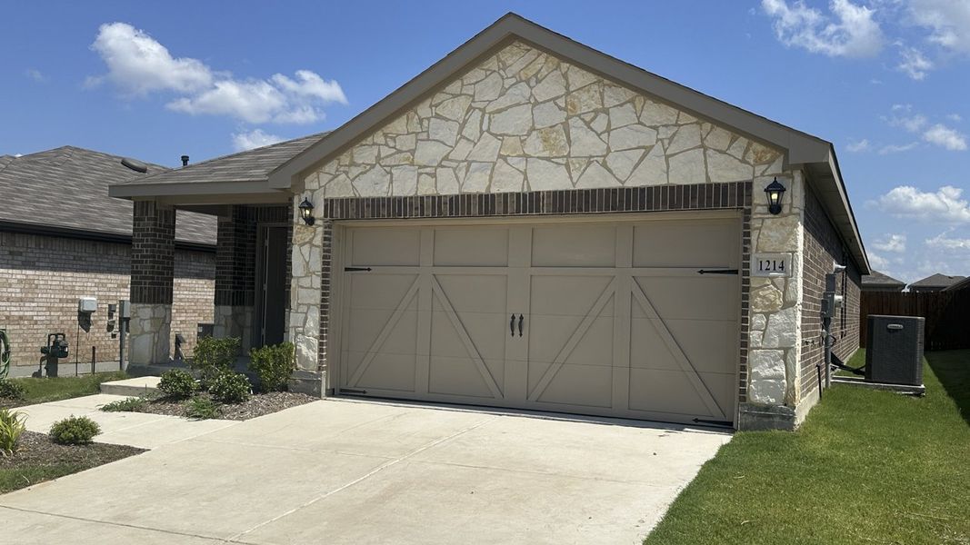 Front exterior of a new home in Cartwright Ranch, Crandall, TX, highlighting curb appeal (Image 2). Front exterior of a new home in Cartwright Ranch, Crandall, TX, highlighting curb appeal (Image 2).