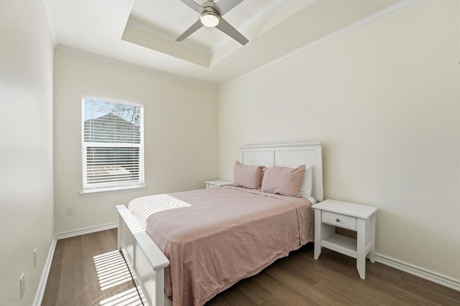 The secondary bedroom provides comfortable space, natural light, and ample closet storage, making it ideal for guests, family, or rental flexibility.