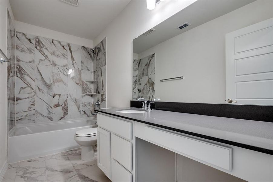 Furnished interior in a model home at Cottonwood Creek in Seagoville (Image 9).