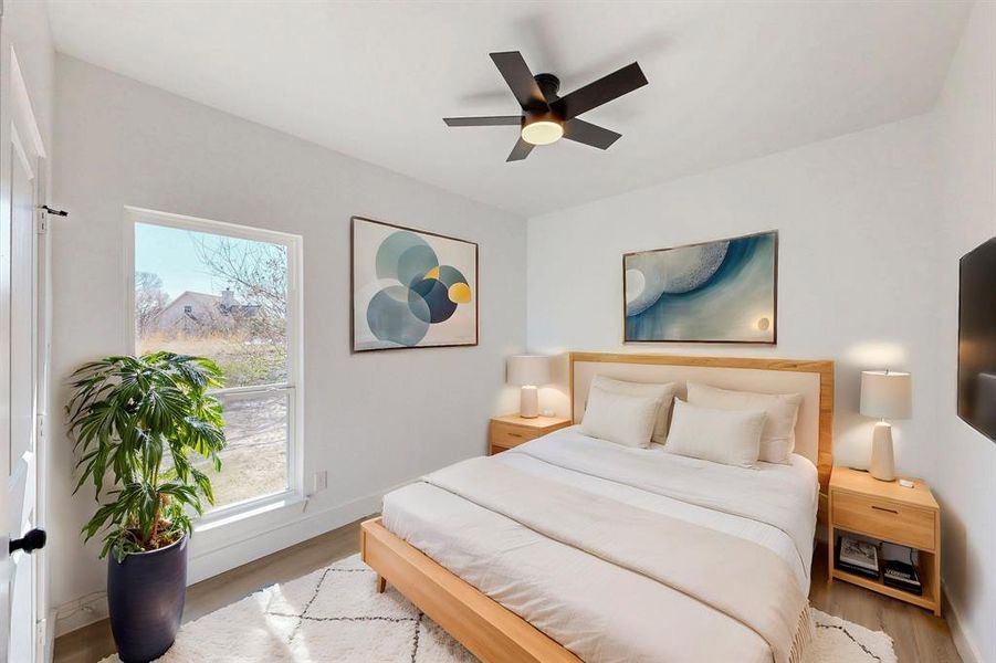 Bedroom with light wood-type flooring and ceiling fan