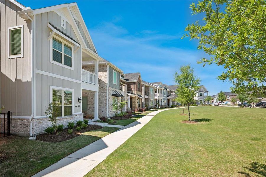 Front exterior of a new home in Bayside, Rowlett, TX, highlighting curb appeal (Image 2).